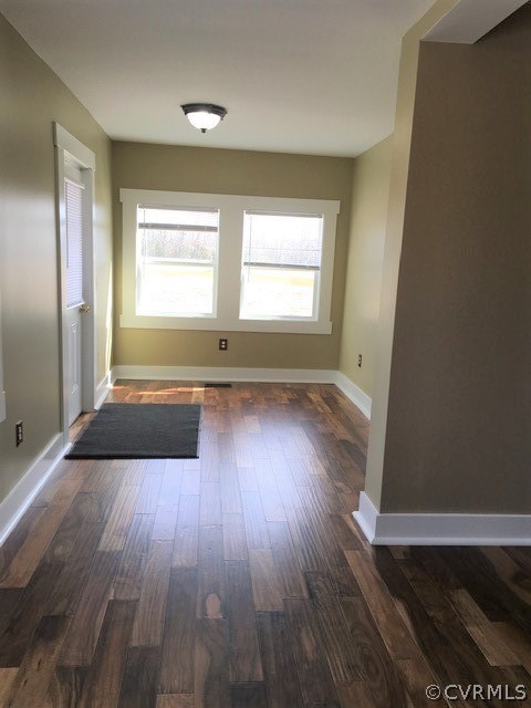 3038 Old Church Road Mechanicsville, VA 23111 - Photo 10 of 26 an empty room with wooden floor and windows