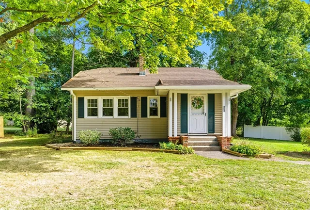 a front view of a house with a yard