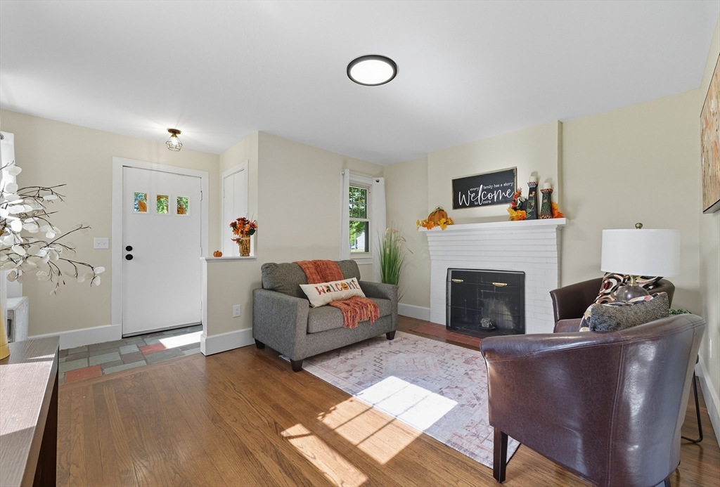636 Amostown Road West Springfield, MA 01089 - Photo 12 of 40 a living room with furniture and a fireplace