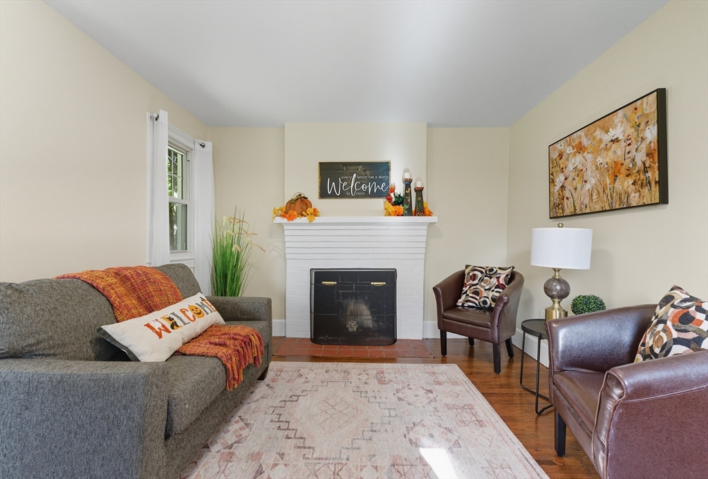 636 Amostown Road West Springfield, MA 01089 - Photo 13 of 40 a living room with furniture and a fireplace