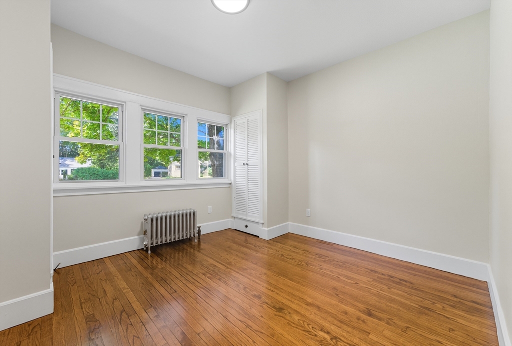636 Amostown Road West Springfield, MA 01089 - Photo 18 of 40 an empty room with wooden floor and windows