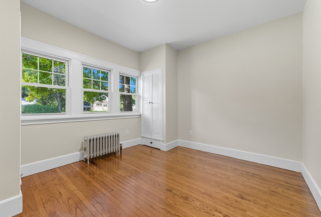 636 Amostown Road West Springfield, MA 01089 - Photo 21 of 40 a view of wooden floor and windows in a room