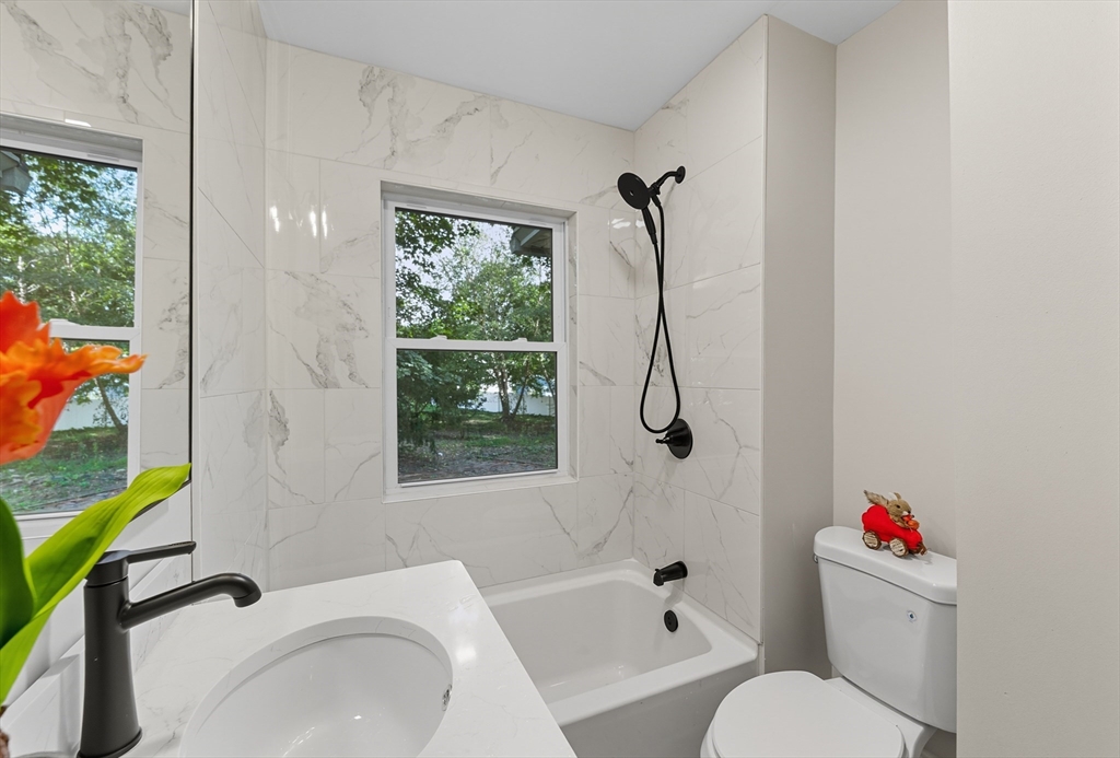 636 Amostown Road West Springfield, MA 01089 - Photo 28 of 40 a bathroom with a sink toilet and shower