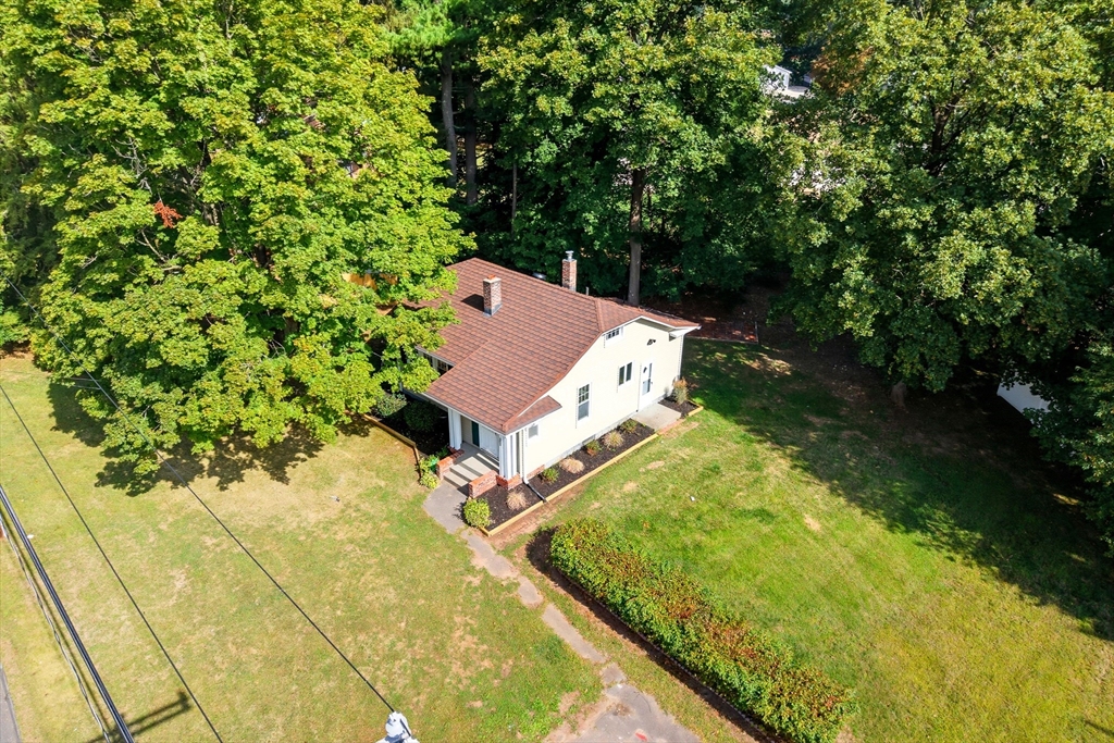 636 Amostown Road West Springfield, MA 01089 - Photo 37 of 40 an aerial view of a house with swimming pool and large trees