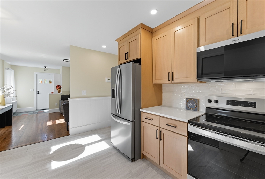 636 Amostown Road West Springfield, MA 01089 - Photo 5 of 40 a kitchen with stainless steel appliances a refrigerator stove and microwave