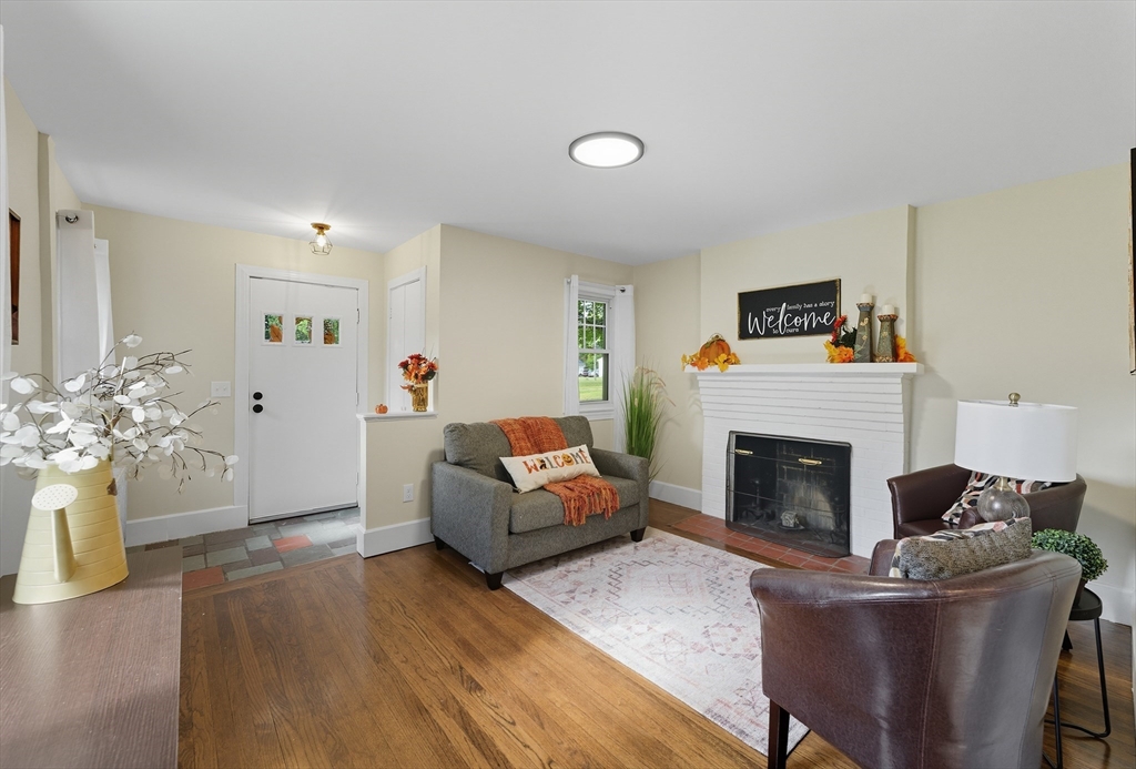 636 Amostown Road West Springfield, MA 01089 - Photo 10 of 40 a living room with furniture and a fireplace