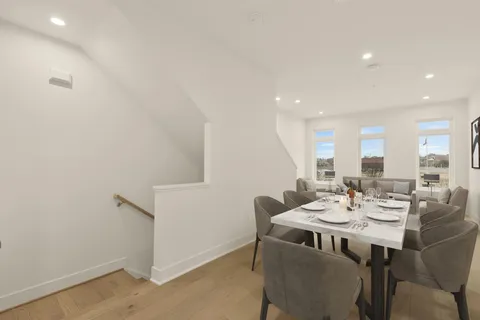 a view of a livingroom with furniture and staircase