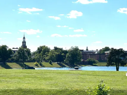 a view of a lake with a house in the background