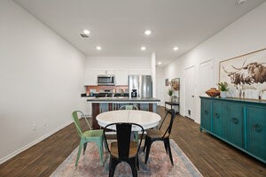 549 Arnold Loop, Unit A Kyle, TX 78640 - Photo 10 of 31 a view of a dining room with furniture