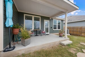 549 Arnold Loop, Unit A Kyle, TX 78640 - Photo 21 of 31 a house with outdoor seating space