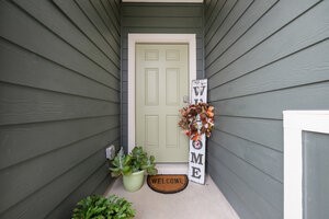 549 Arnold Loop, Unit A Kyle, TX 78640 - Photo 3 of 31 a potted plant sitting in front of a door