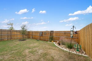 549 Arnold Loop, Unit A Kyle, TX 78640 - Photo 29 of 31 a view of a backyard