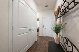 549 Arnold Loop, Unit A Kyle, TX 78640 - Photo 6 of 31 a view of a entryway with wooden floor