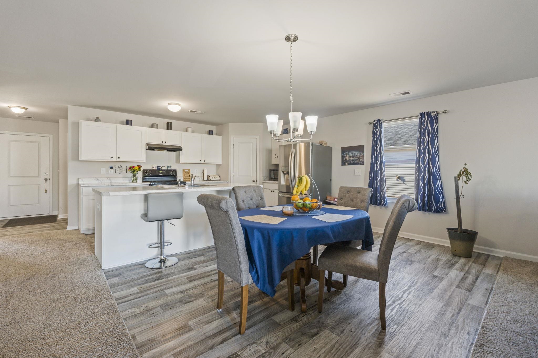 520 Dundalk Drive Conway, SC 29526 - Photo 16 of 35 Dining area with light wood-type flooring and a chandelier