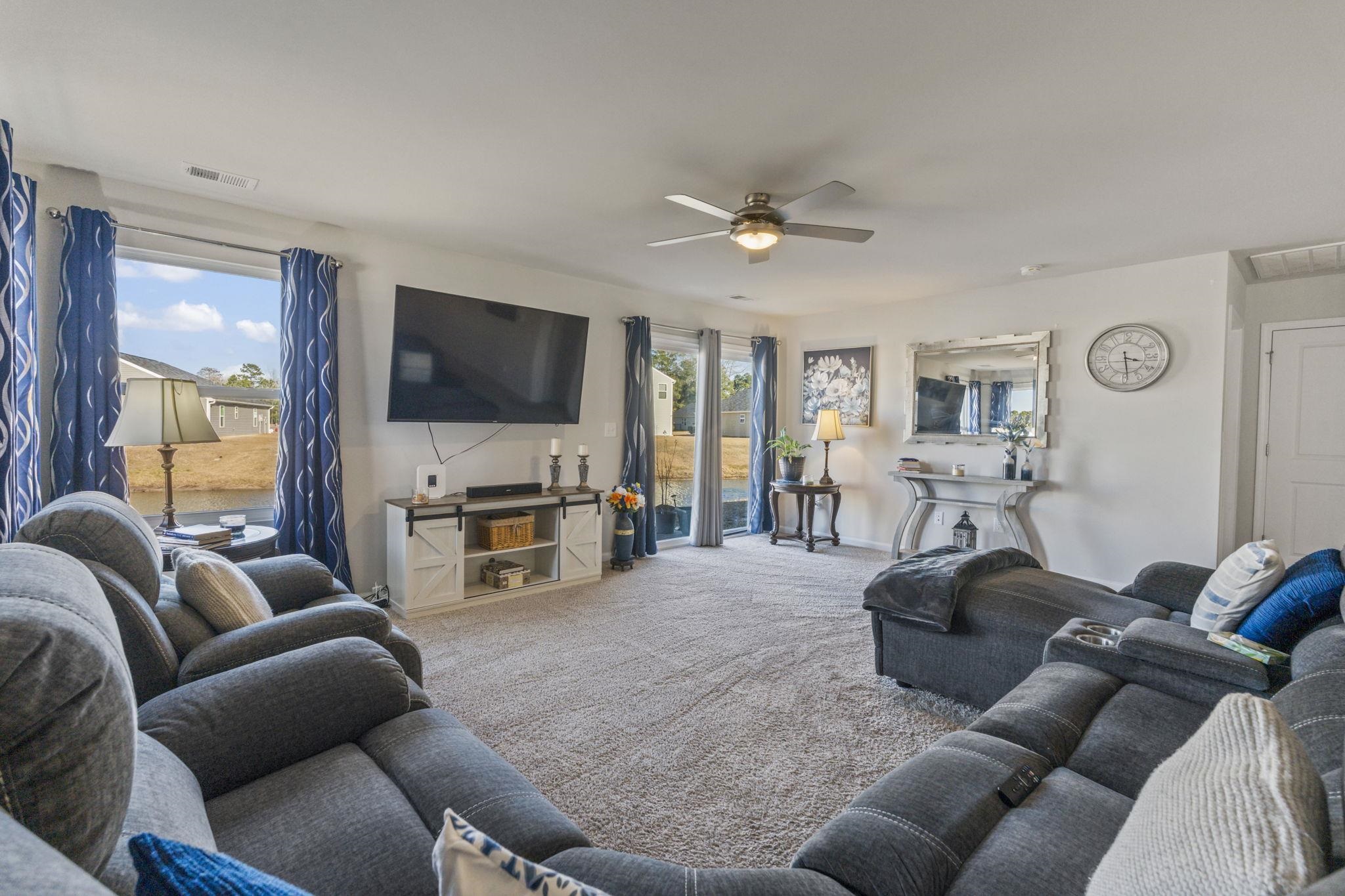 520 Dundalk Drive Conway, SC 29526 - Photo 17 of 35 Carpeted living room with a ceiling fan and baseboards