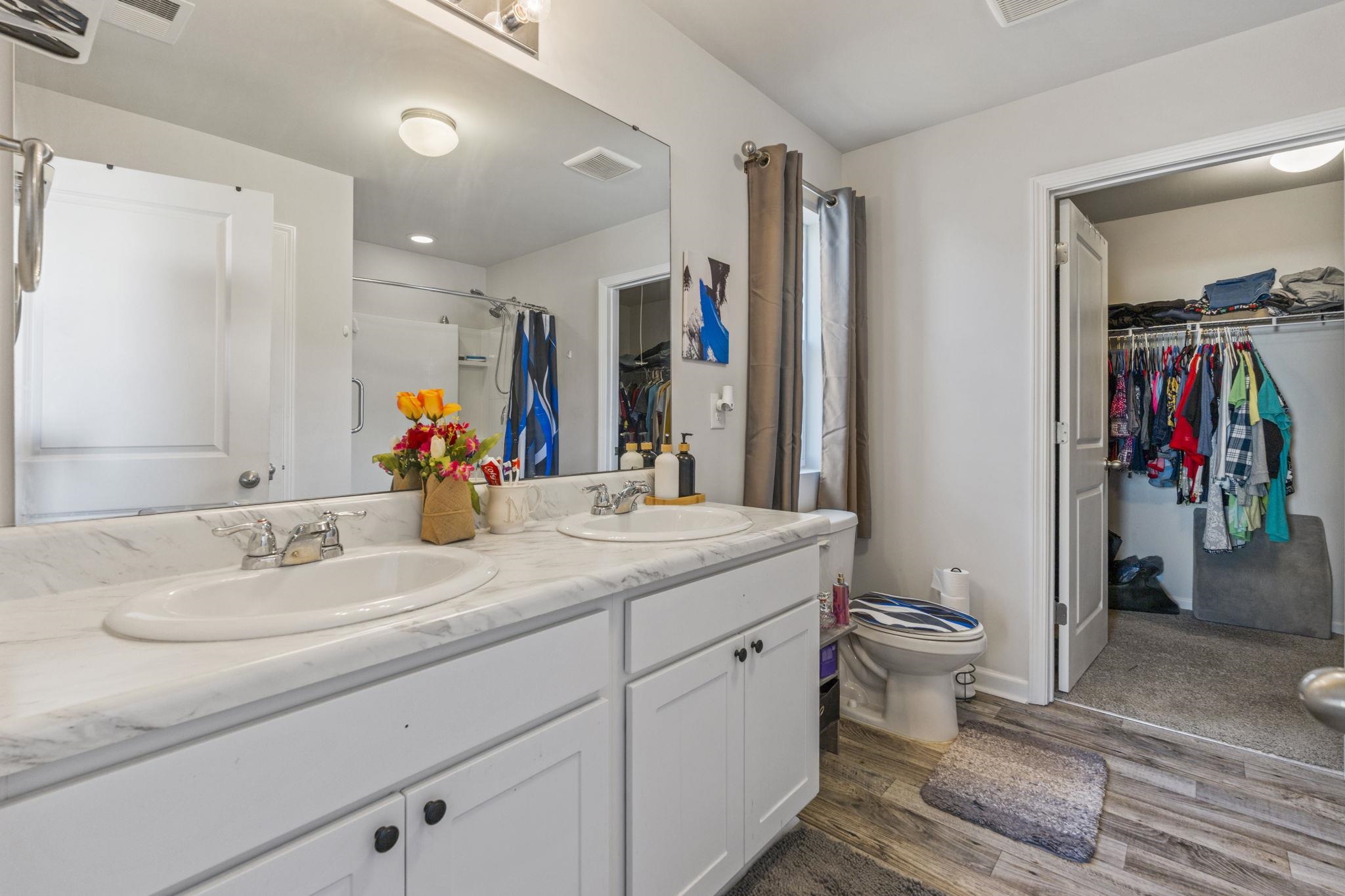 520 Dundalk Drive Conway, SC 29526 - Photo 21 of 35 Full bath with a spacious closet, double vanity, dark wood-type flooring, and a shower