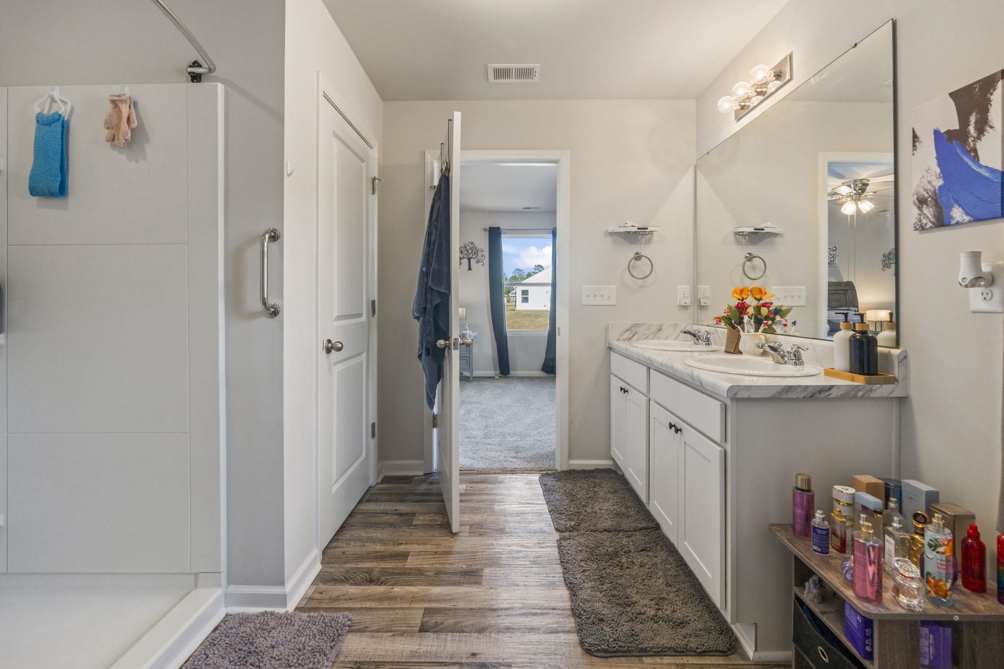 520 Dundalk Drive Conway, SC 29526 - Photo 23 of 35 Bathroom featuring ensuite bath, double vanity, walk in shower, and dark wood-style floors