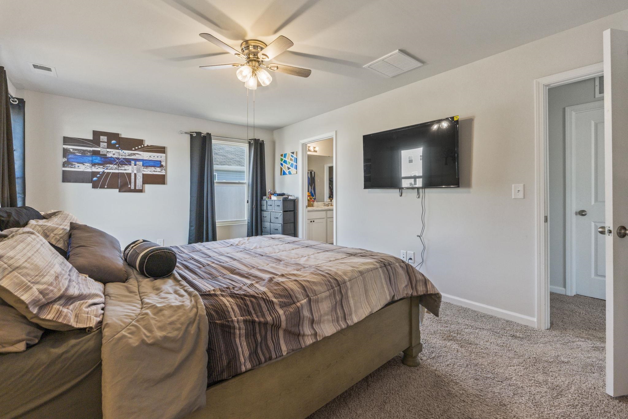 520 Dundalk Drive Conway, SC 29526 - Photo 25 of 35 Bedroom with carpet floors, ceiling fan, and ensuite bathroom
