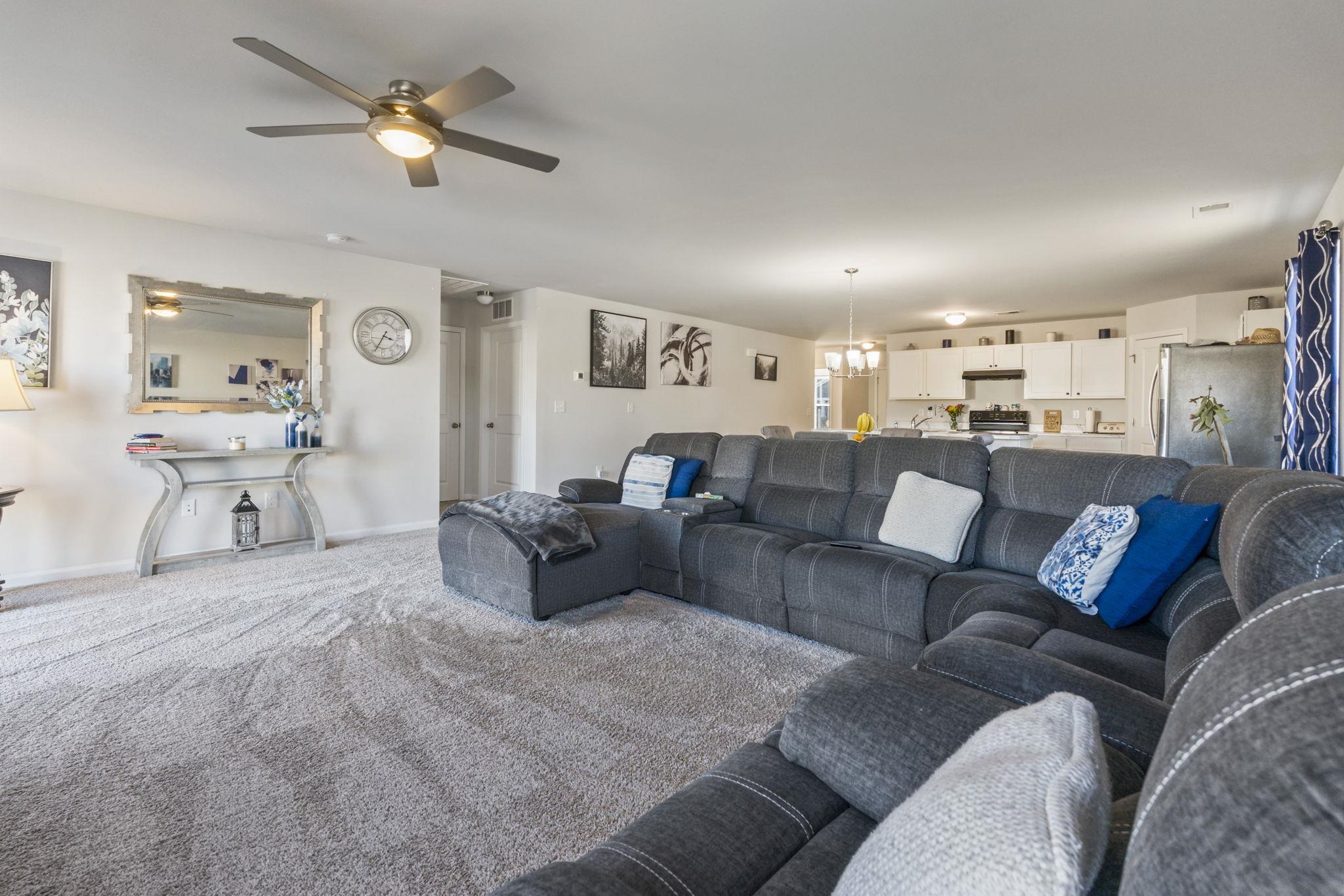 520 Dundalk Drive Conway, SC 29526 - Photo 26 of 35 Carpeted living room with a chandelier and a ceiling fan