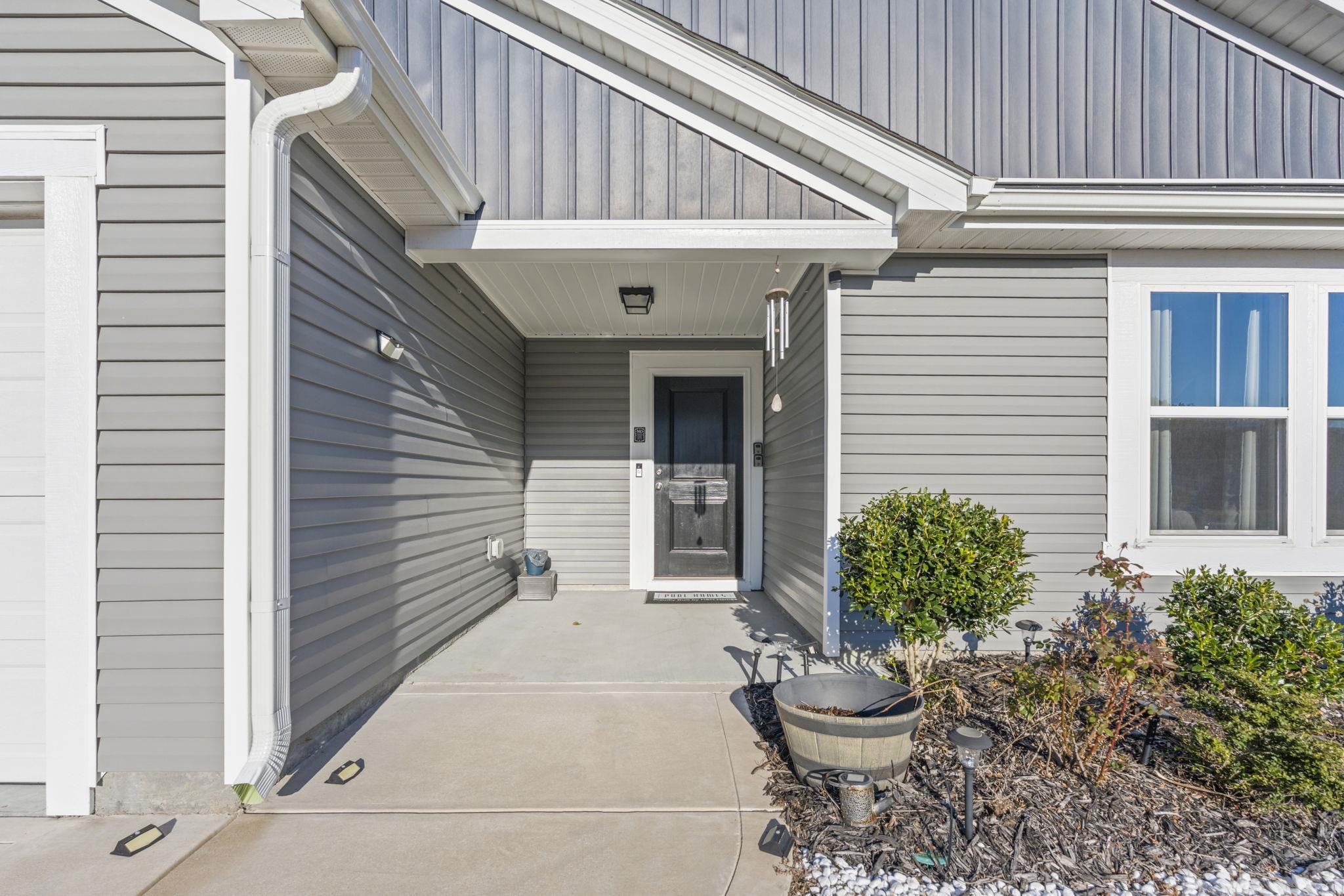520 Dundalk Drive Conway, SC 29526 - Photo 31 of 35 Property entrance featuring board and batten siding and a garage