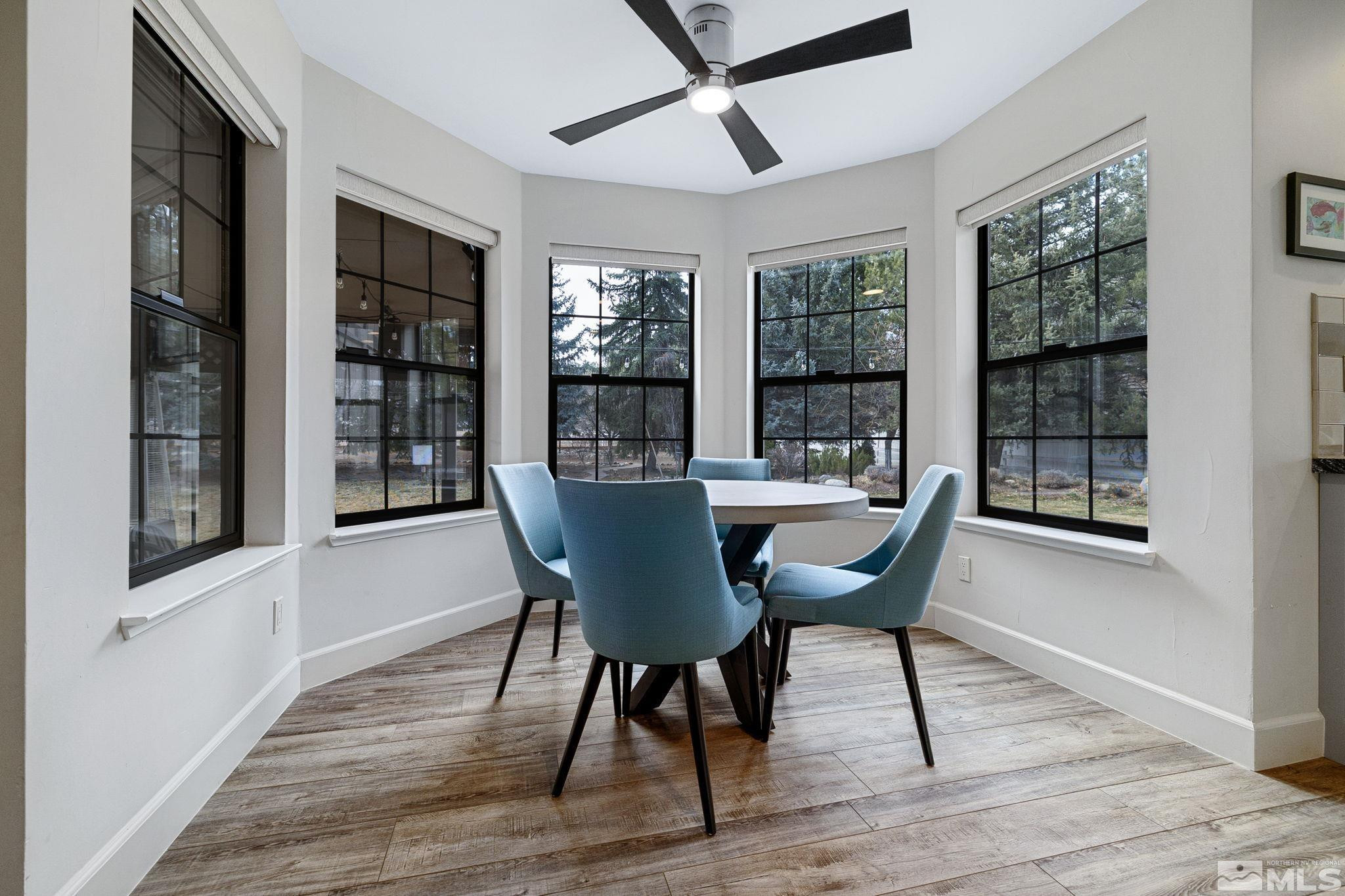 1075 Country Estates Circle Reno, NV 89511 - Photo 18 of 40 a view of a dining room with furniture window and wooden floor
