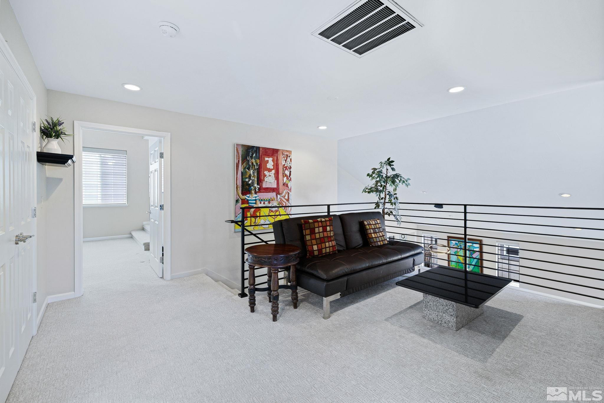 1075 Country Estates Circle Reno, NV 89511 - Photo 19 of 40 a reading room with furniture and wooden floor