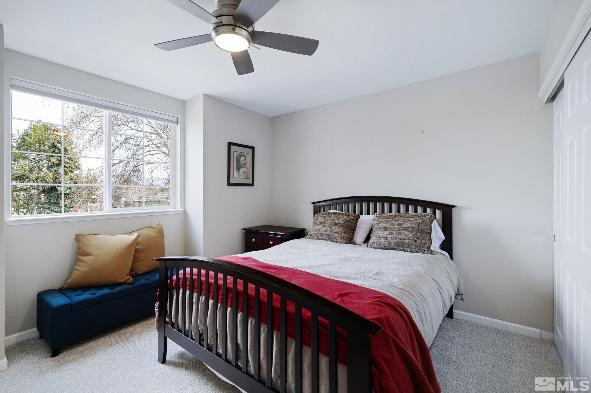 1075 Country Estates Circle Reno, NV 89511 - Photo 20 of 40 a bedroom with a bed and a window