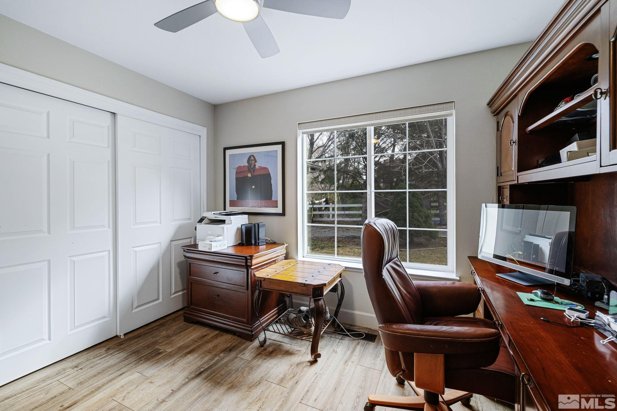 1075 Country Estates Circle Reno, NV 89511 - Photo 32 of 40 a view of a workspace with furniture and a window