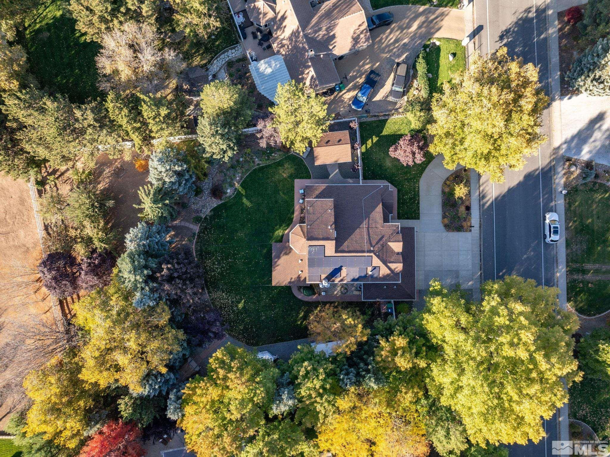 1075 Country Estates Circle Reno, NV 89511 - Photo 5 of 40 a view of a house with a yard and garden