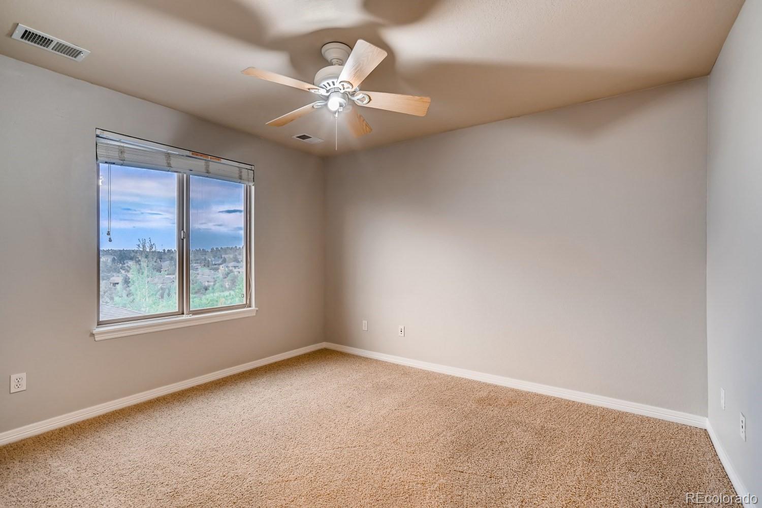 1644 Ridge Trail Lane Castle Rock, CO 80104 - Photo 29 of 38 an empty room with a window