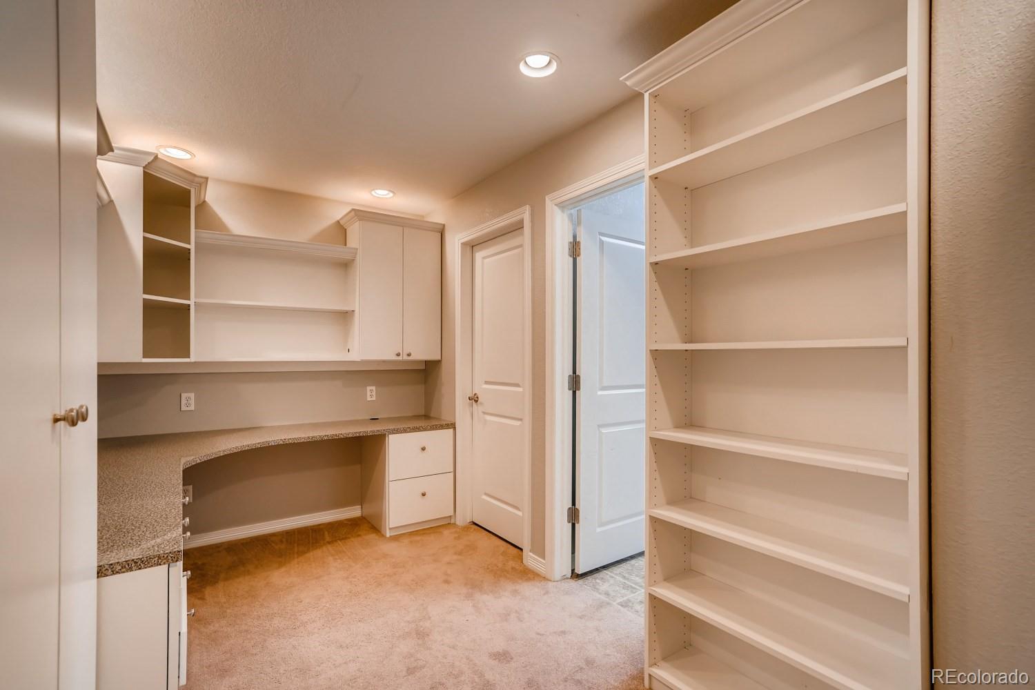 1644 Ridge Trail Lane Castle Rock, CO 80104 - Photo 34 of 38 a view of an empty room with empty racks
