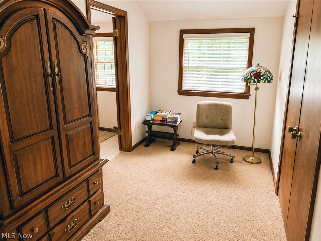 6155 Gibson Road Canfield, OH 44406 - Photo 28 of 43 Carpeted primary bedroom featuring a window with blinds, wood trim, and entry to the primary bathroom