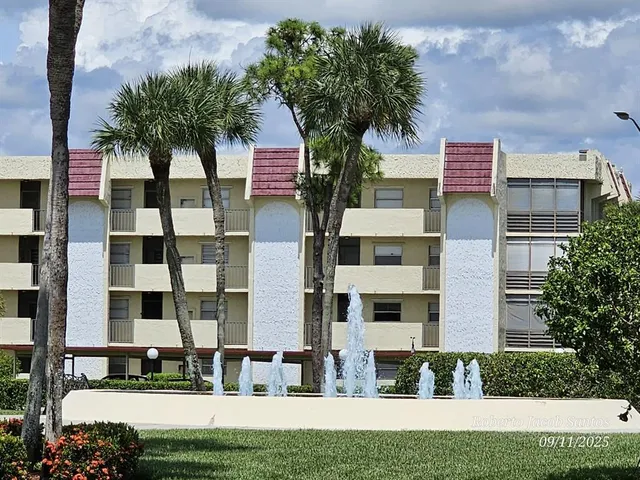 a view of a building with a yard