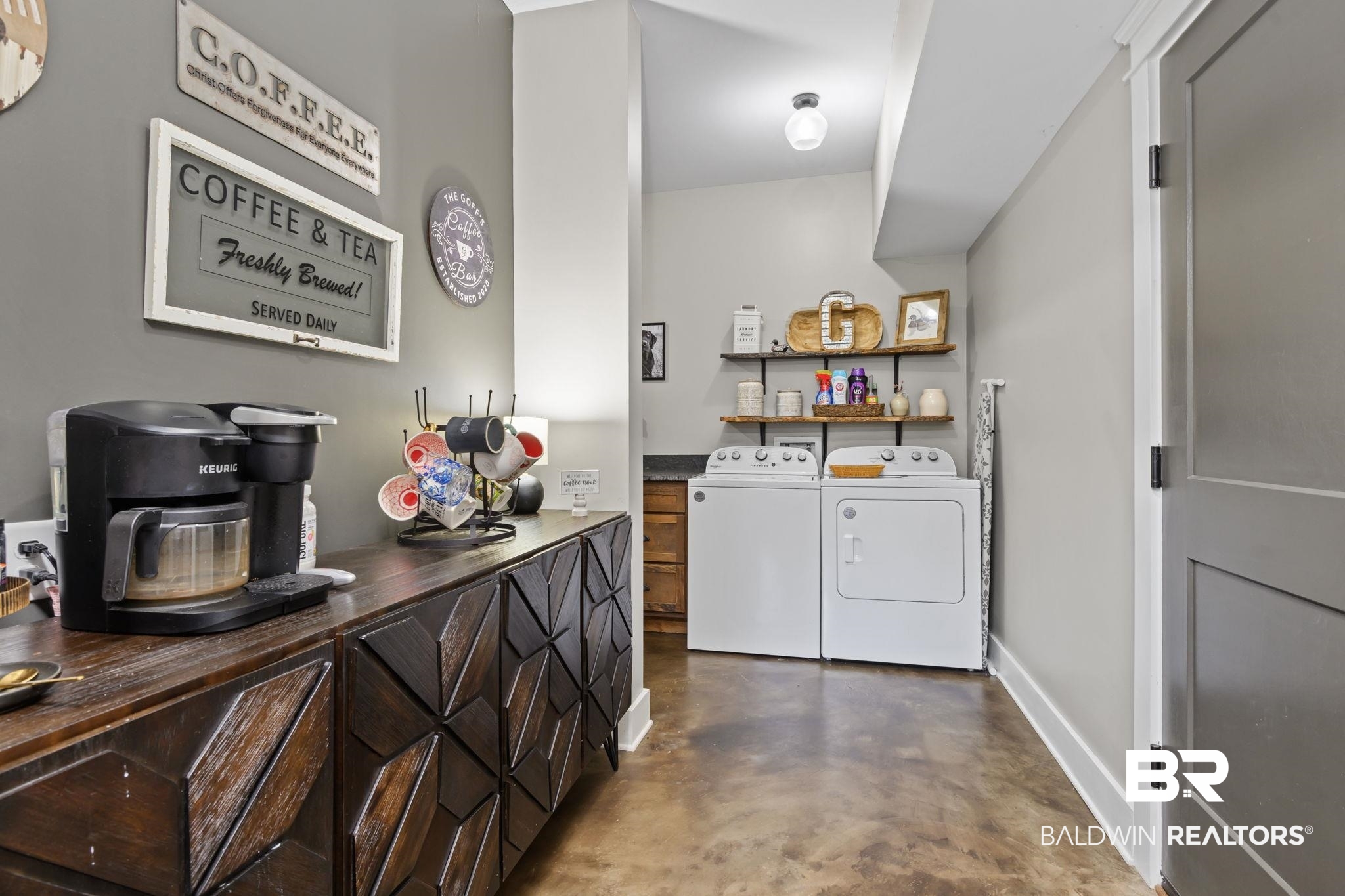 11025 Creax Road Axis, AL 36505 - Photo 18 of 45 Utility area featuring a built-in wood-finish cabinet with geometric paneling, open shelving, and a built-in countertop