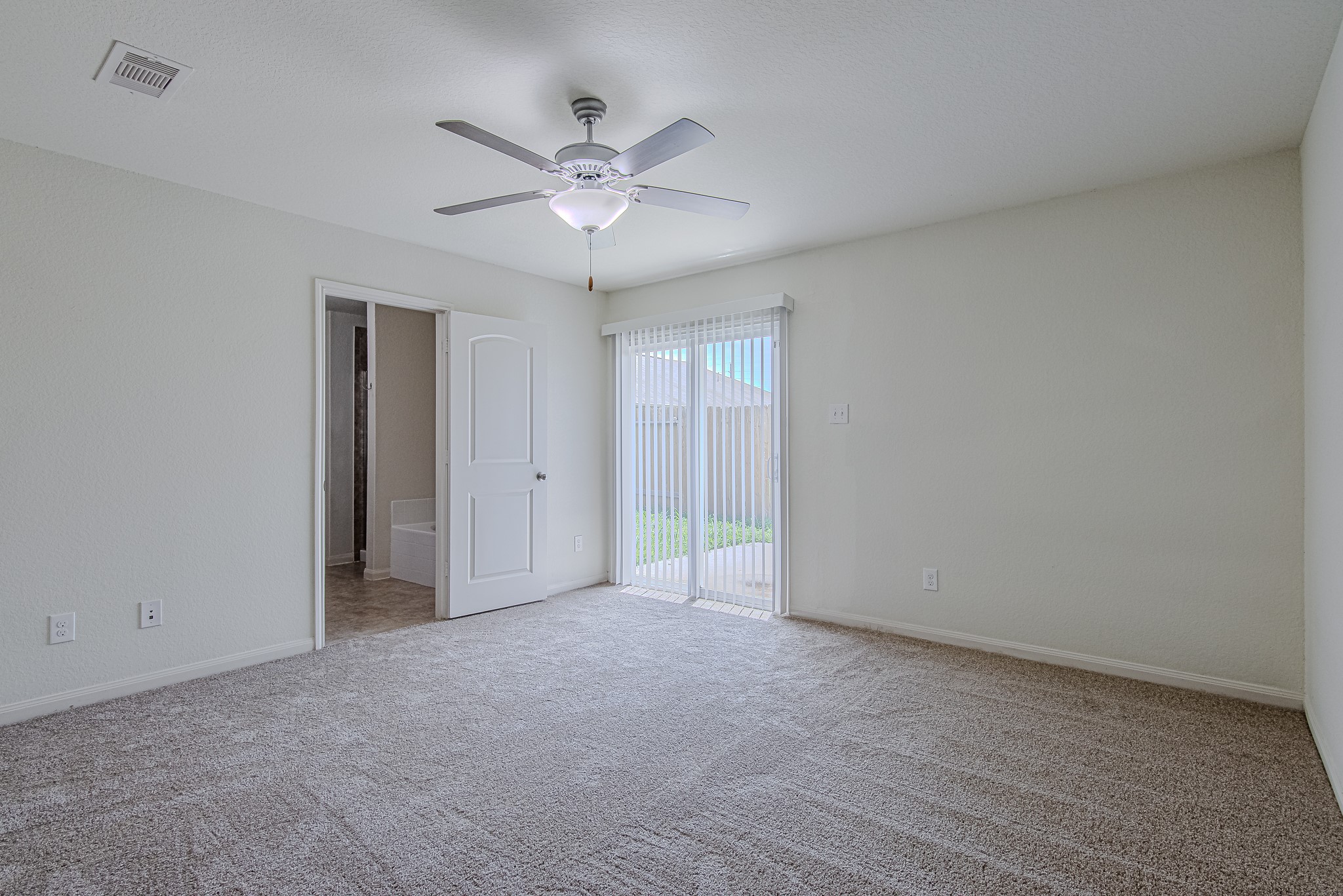 9522 Olive Stone Drive Rosharon, TX 77583 - Photo 16 of 29 a view of an empty room with a chandelier fan