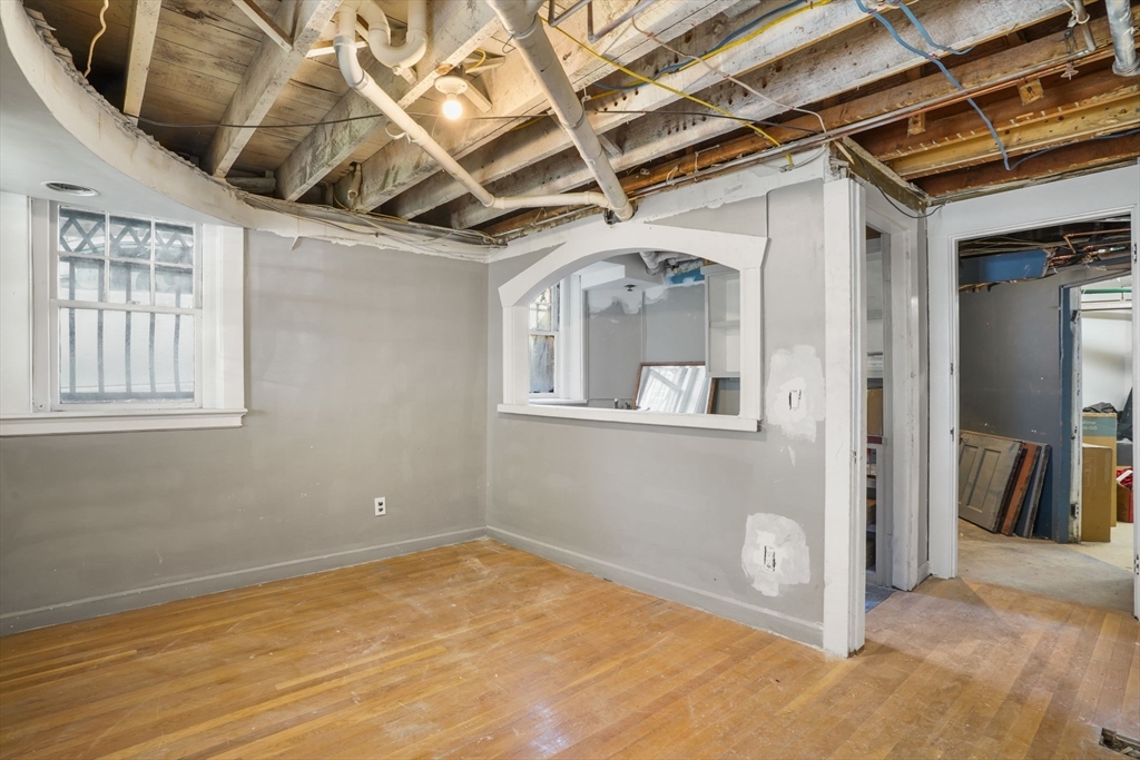 33-35 Russell Street, Unit 1 Brookline, MA 02446 - Photo 13 of 16 a view of a hallway with windows