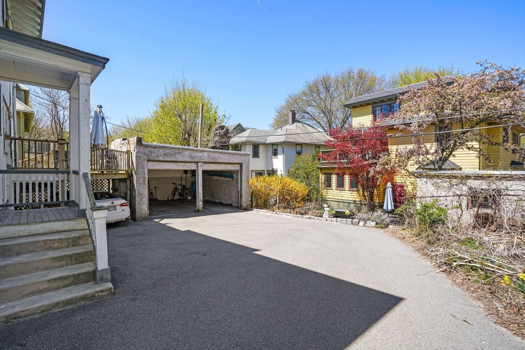 33-35 Russell Street, Unit 1 Brookline, MA 02446 - Photo 15 of 16 a view of a house with a patio