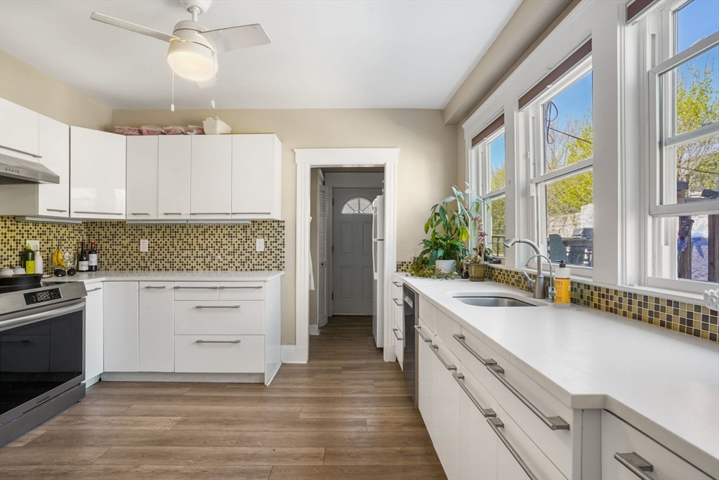 33-35 Russell Street, Unit 1 Brookline, MA 02446 - Photo 4 of 16 a kitchen with a stove oven and sink