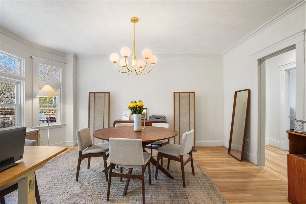 33-35 Russell Street, Unit 1 Brookline, MA 02446 - Photo 5 of 16 a view of a dining room with furniture window and wooden floor
