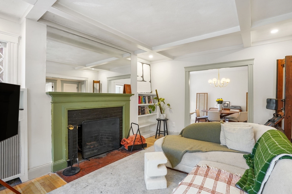 33-35 Russell Street, Unit 1 Brookline, MA 02446 - Photo 6 of 16 a living room with furniture and a fireplace