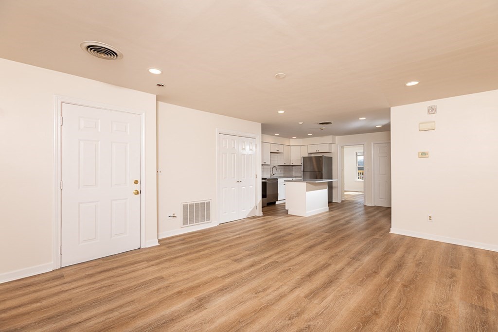 2 Farragut Road, Unit 5 Ipswich, MA 01938 - Photo 5 of 15 a view of a kitchen with a refrigerator and a stove top oven