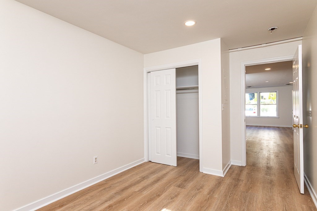 2 Farragut Road, Unit 5 Ipswich, MA 01938 - Photo 9 of 15 an empty room with wooden floor and windows