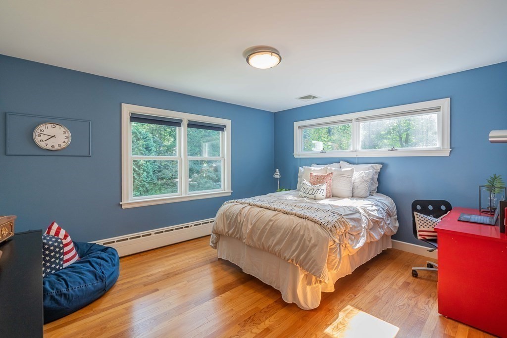 49 Baskin Road Lexington, MA 02421 - Photo 30 of 42 a bedroom with bed and a window