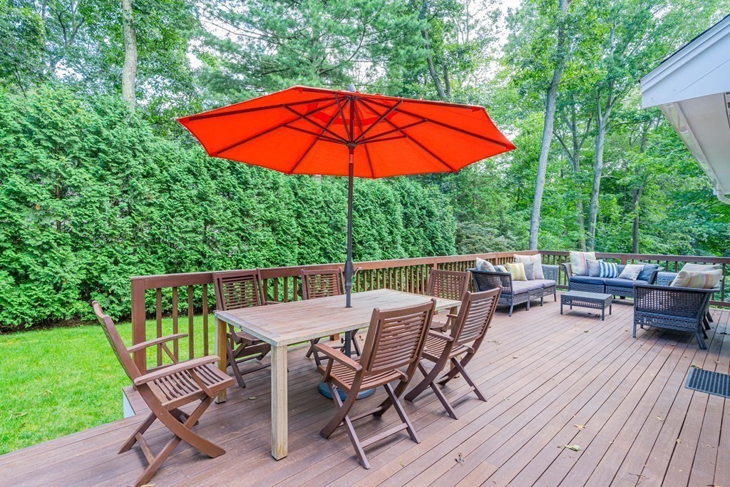 49 Baskin Road Lexington, MA 02421 - Photo 39 of 42 an outdoor space with furniture and umbrella