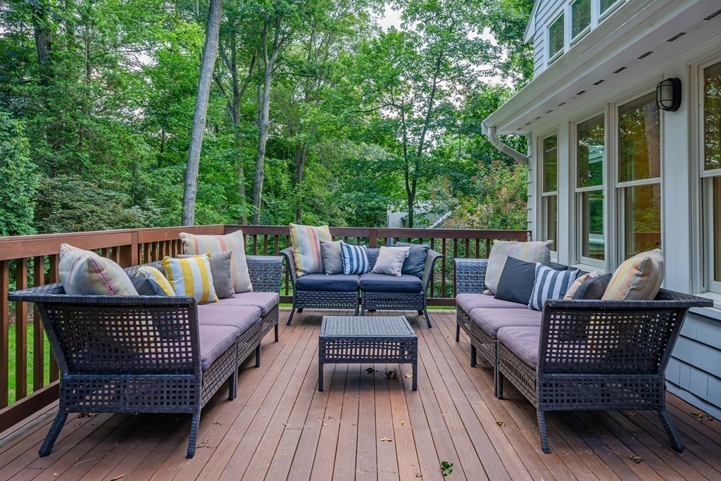 49 Baskin Road Lexington, MA 02421 - Photo 40 of 42 a view of a roof deck with a table and chairs