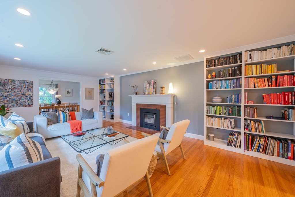 49 Baskin Road Lexington, MA 02421 - Photo 4 of 42 a living room with furniture and a book shelf