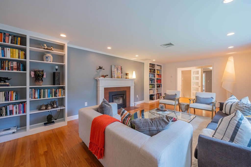 49 Baskin Road Lexington, MA 02421 - Photo 6 of 42 a living room with furniture and a fireplace