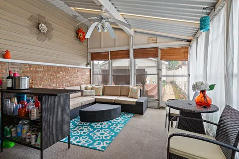 a outdoor living space with furniture and a potted plant