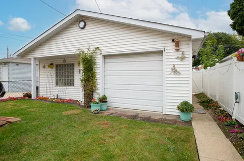 a front view of a house and a yard