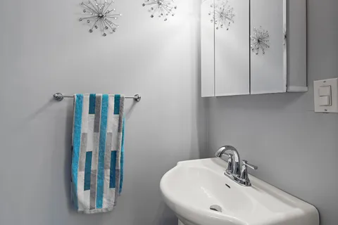 a bathroom with a sink and mirror